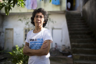 Maria da Penha Macena, long-term resident and community organizer of the Vila Autódromo waterfront community, in Rio de Janeiro’s West Zone. Image by: Mauro Pimentel