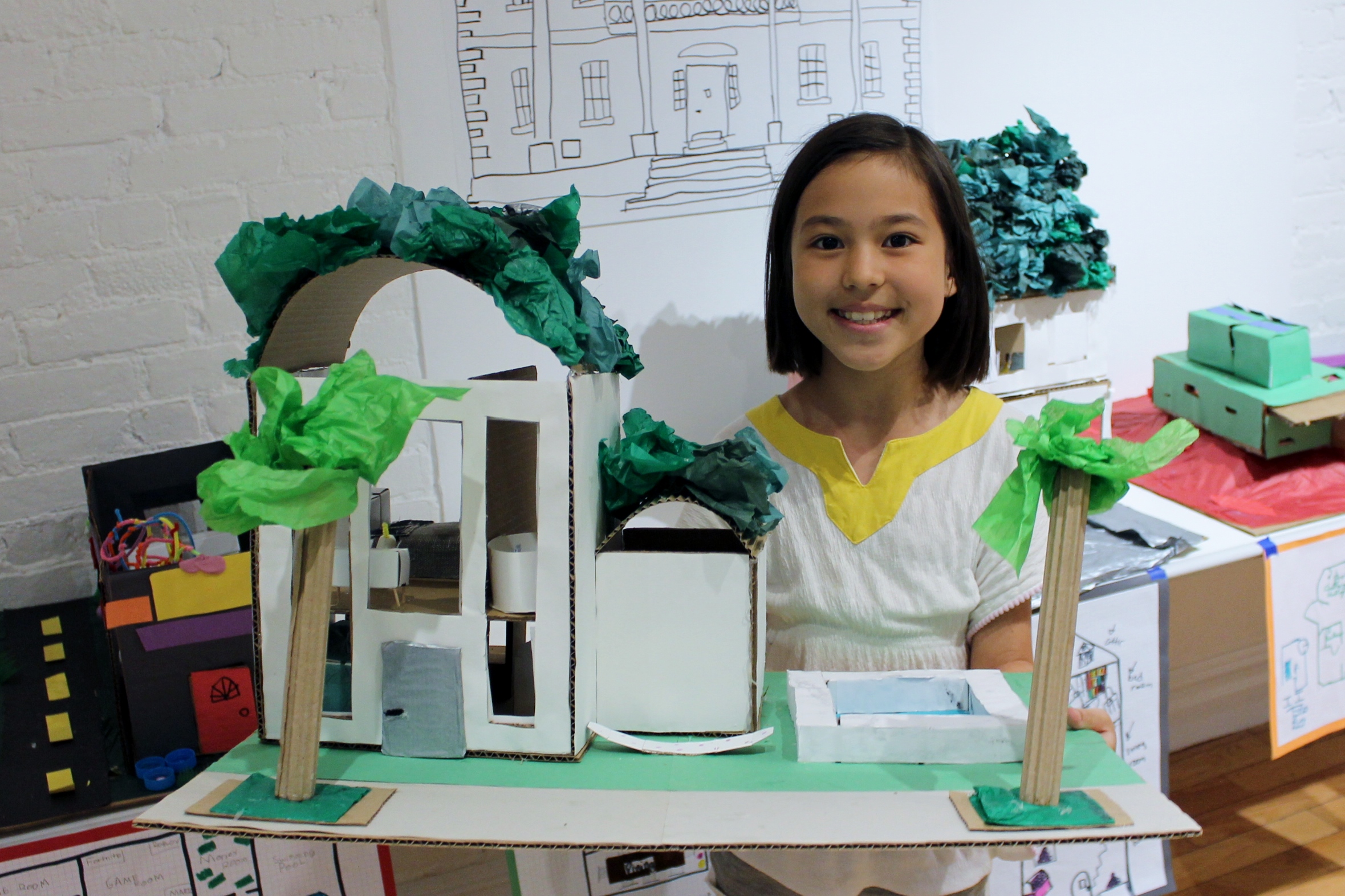 Elementary school student with architecture model
