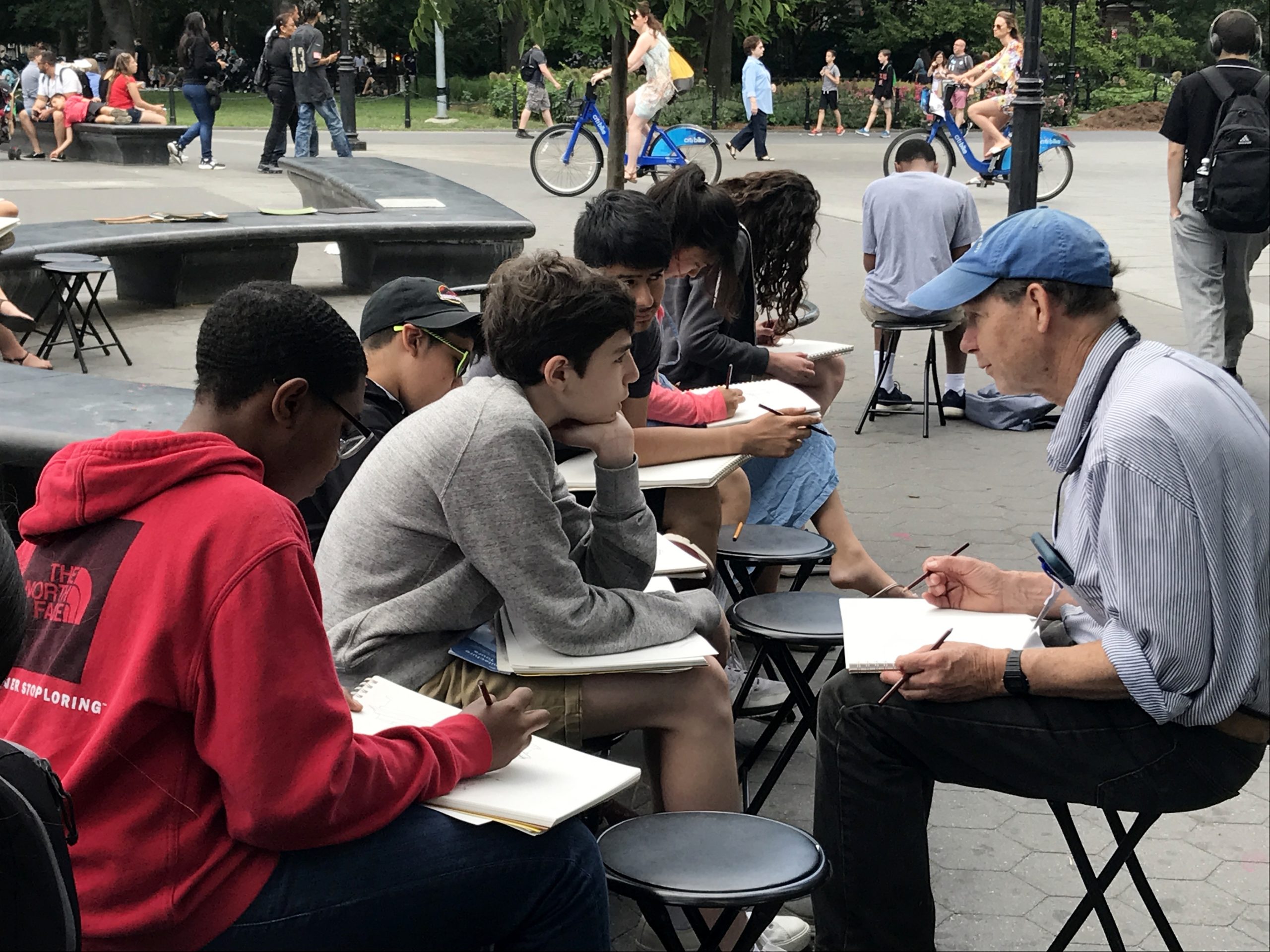 High school students sketching outside
