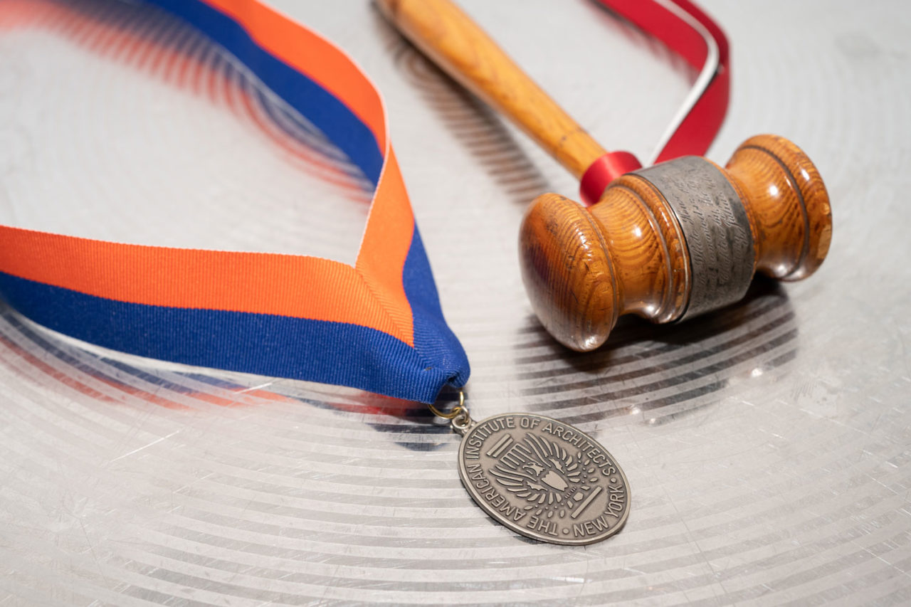 Closeup of the AIA Presidential medal and gavel