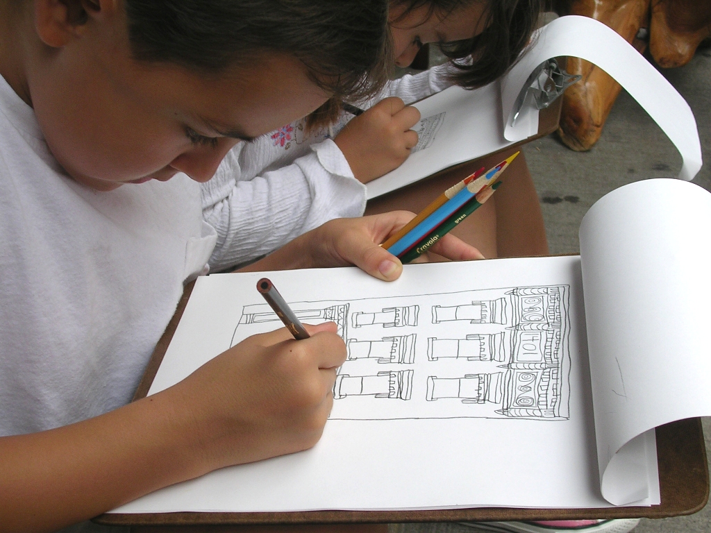 Children drawing building facades