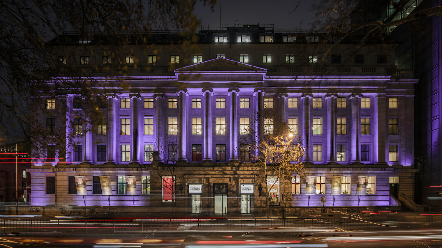 Wellcome Collection. Exterior building lit up in purple to recognise International Day of Persons with Disabilities / PurpleLightUp campaign. Photo courtesy of Wellcome Collection.