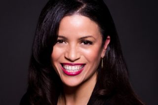 This is a headshot image of Nicole Hollant-Denis, AIA.