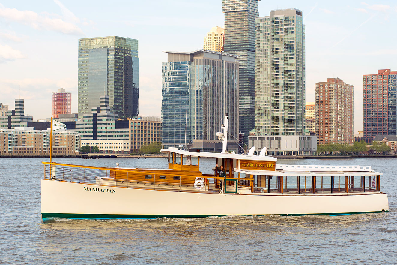 Classic Harbor Line yacht on the water with the Manhattan skyline in the background