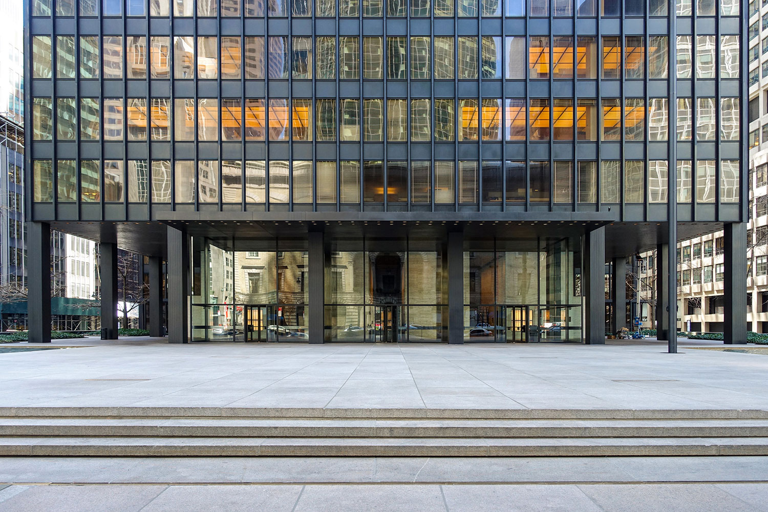 Exterior facade of the Seagram Building at the ground floor entry level.