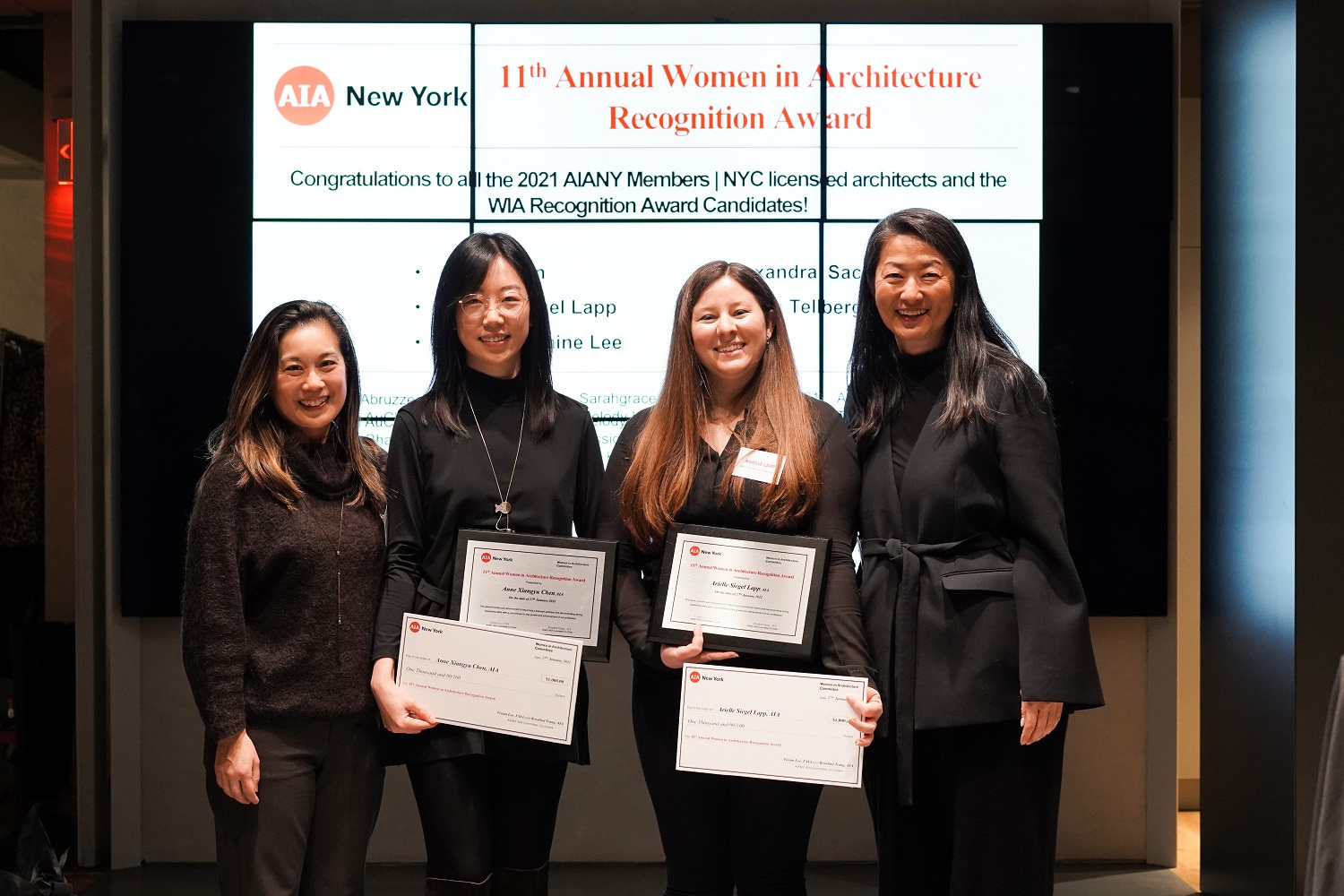 Four women posing for a photo and holding award certificates at the 11th Annual WIA Recognition Award
