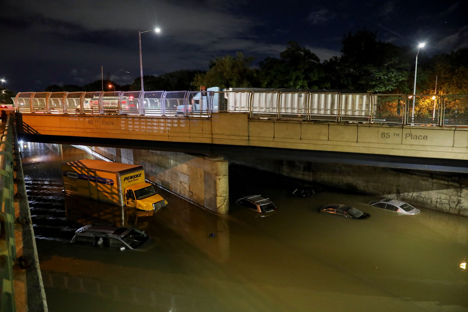 Image of vehicles submerged on a waterlogged road in New York, the United States, Sept. 2, 2021