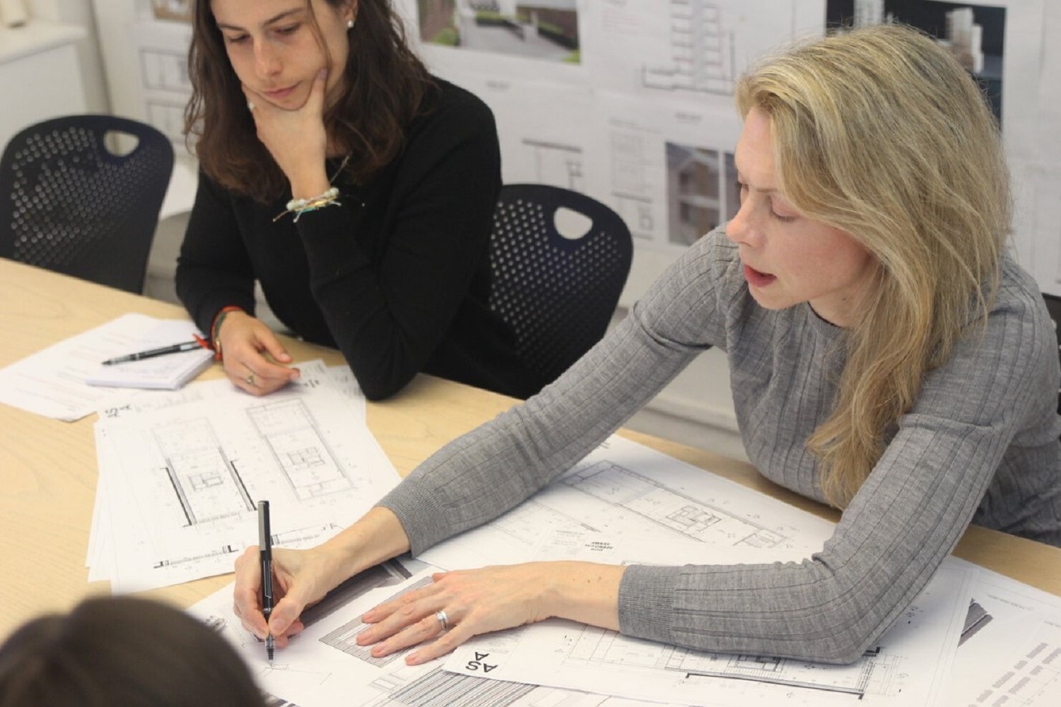 Architects in a meeting at Andrea Steele Architecture Firm