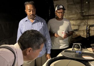 Image of Panelist describing the Geothermal System in a retrofit house