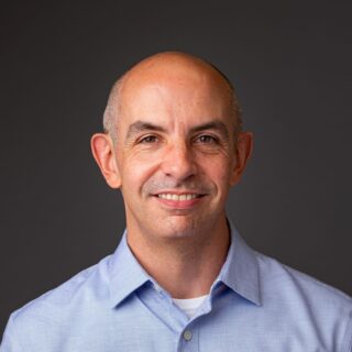 Headshot of Chris Cirillo, President and Executive Director, Ascendant Neighborhood Development