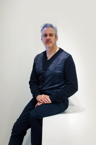 Portrait of Richard Unterthiner sitting posing for the camera