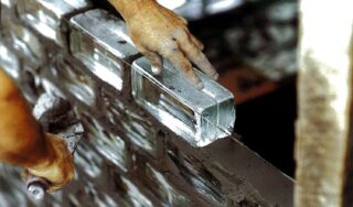 Glass bricks being laid into place in the St. Ann's Warehouse clerestory addition