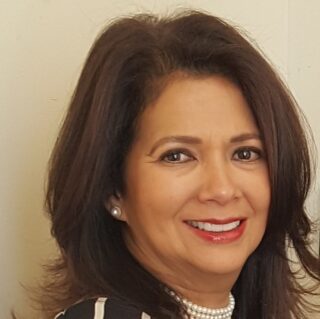 Headshot of Jacqueline Velez, Founder and Principal, JMV Associates, LLC & JMV Architect, PLLC