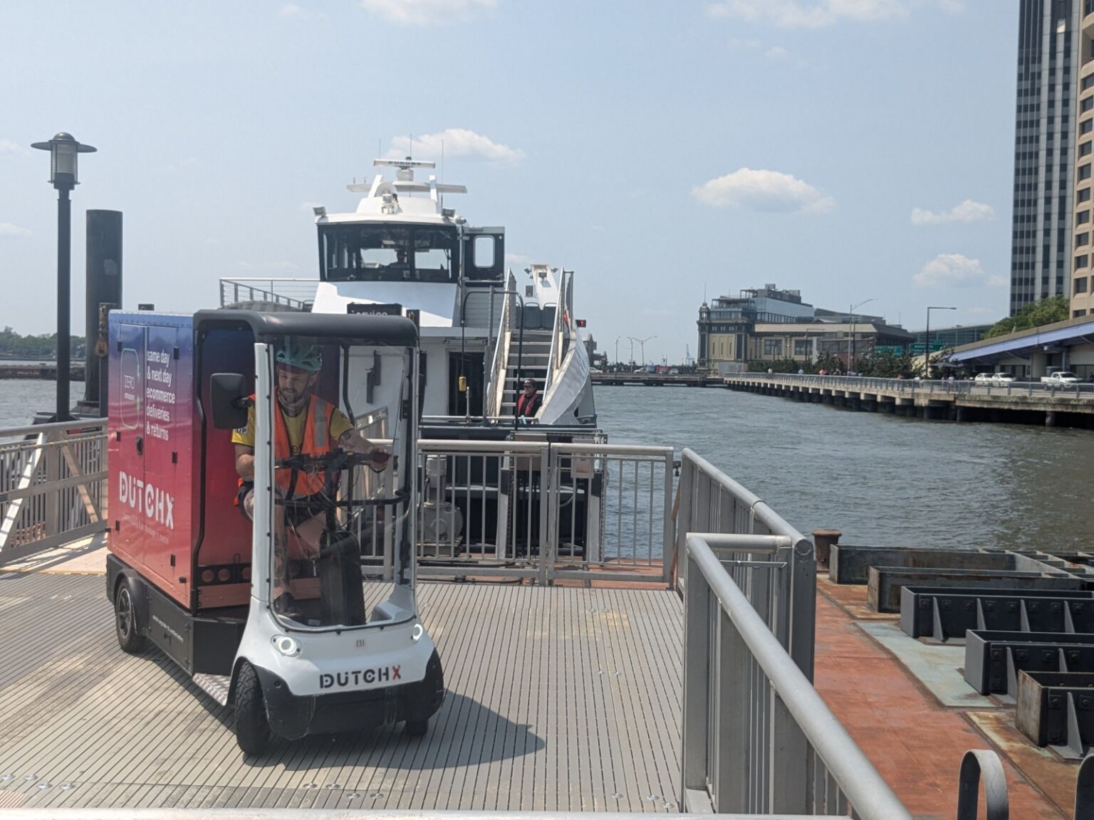Image of a delivery cart and a boat