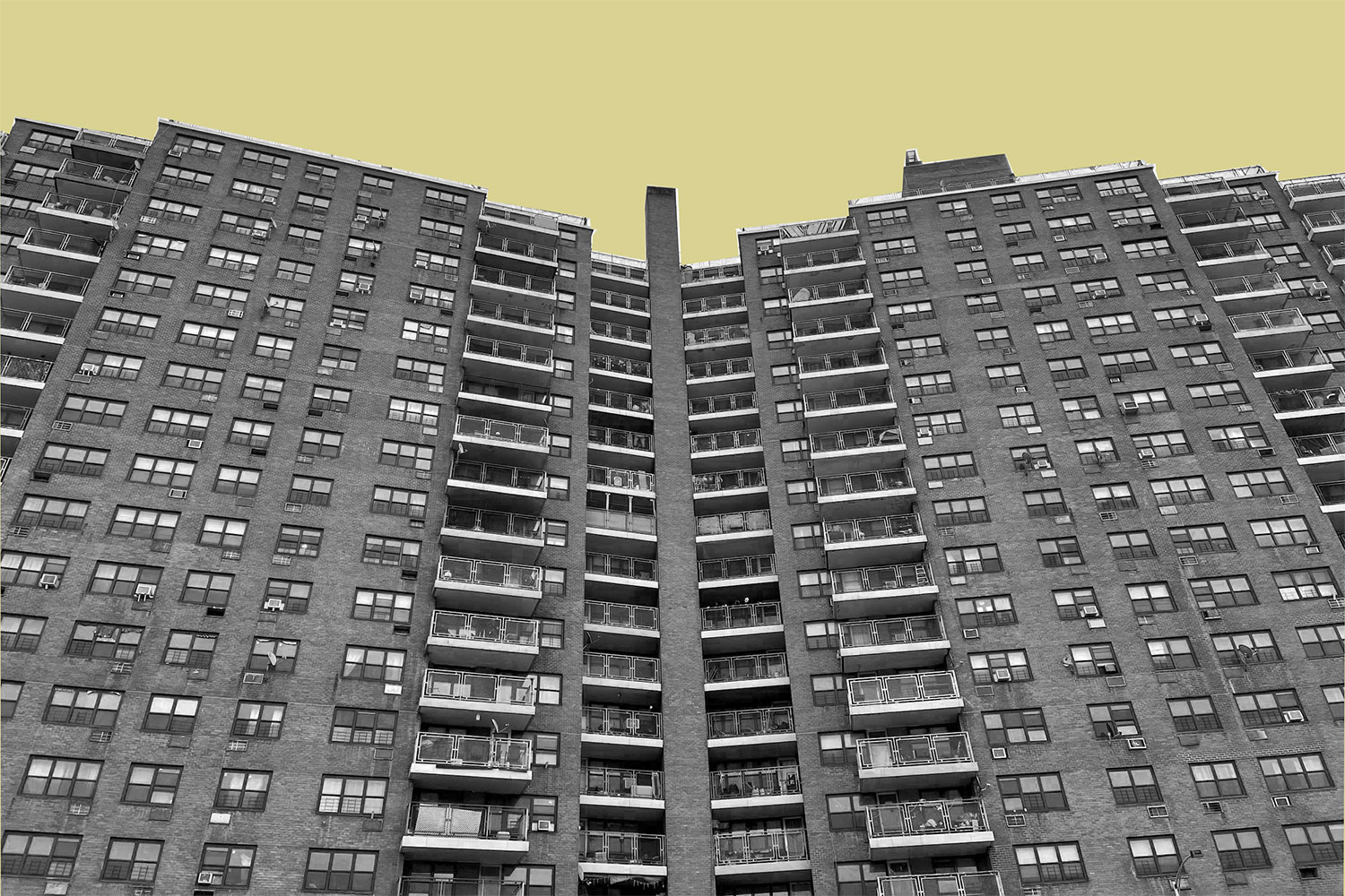 Building facade with a mustard colored sky