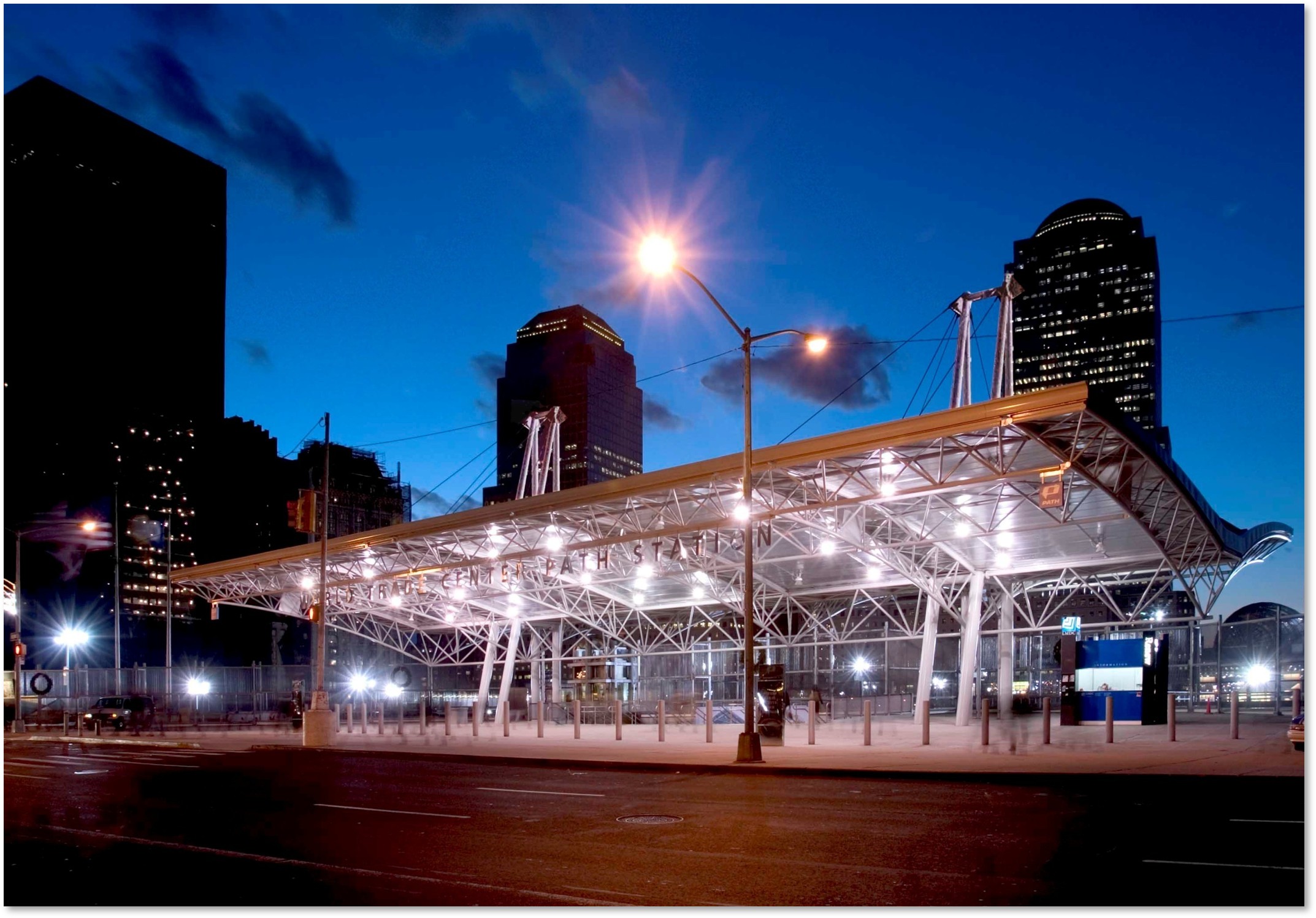 Night-time view of the a lighted canopy which was the temporary PATH Station entry at Church Street Plaza.